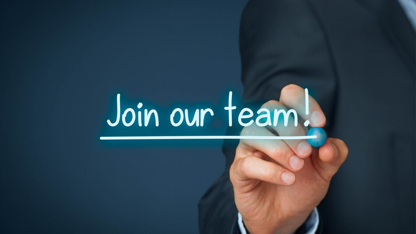 Smiling colleagues gathered